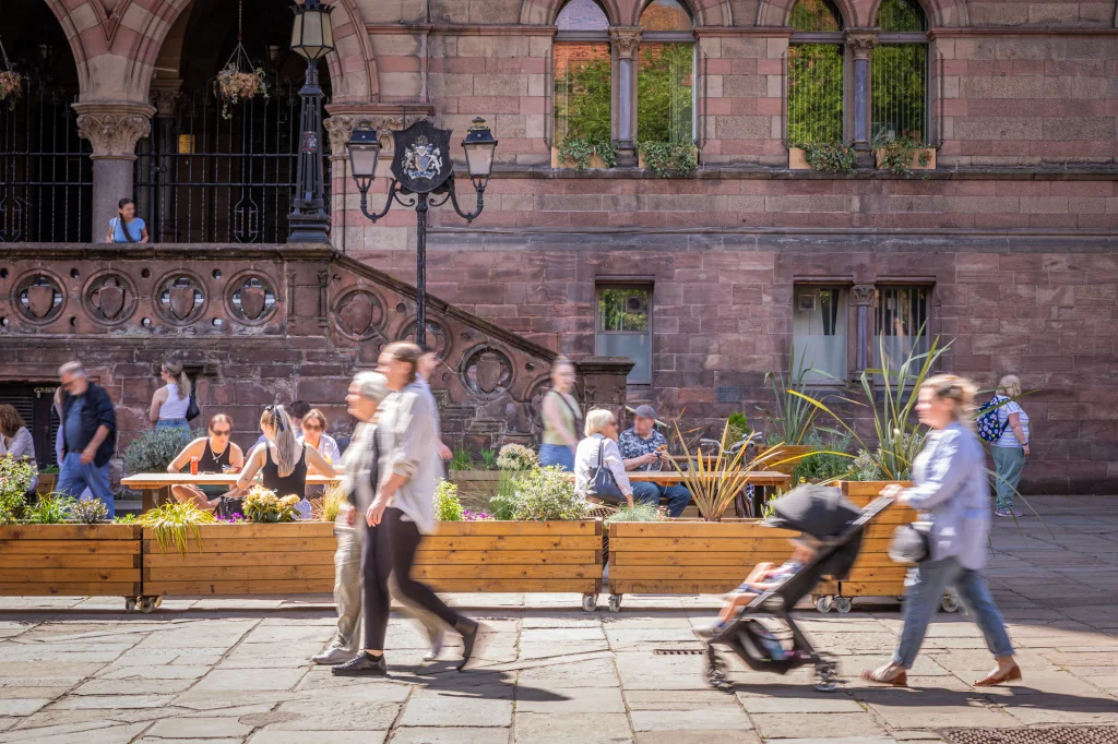People walking past the Pocket Park in Chester Town Hall Square