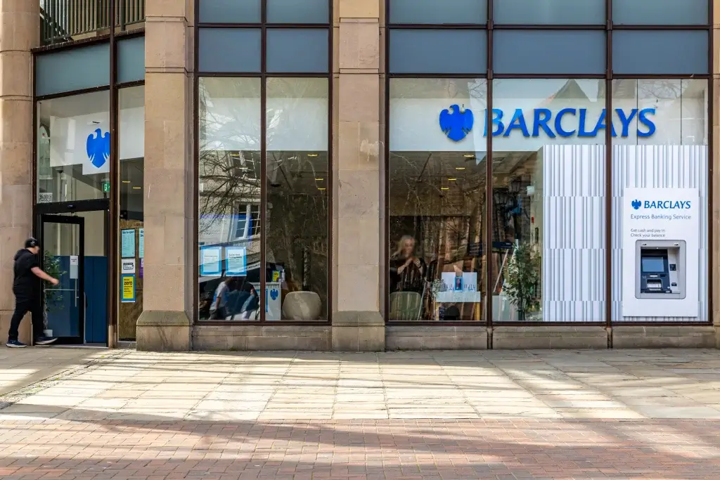 Barclays bank entrance featuring the logo and an ATM for express banking services.
