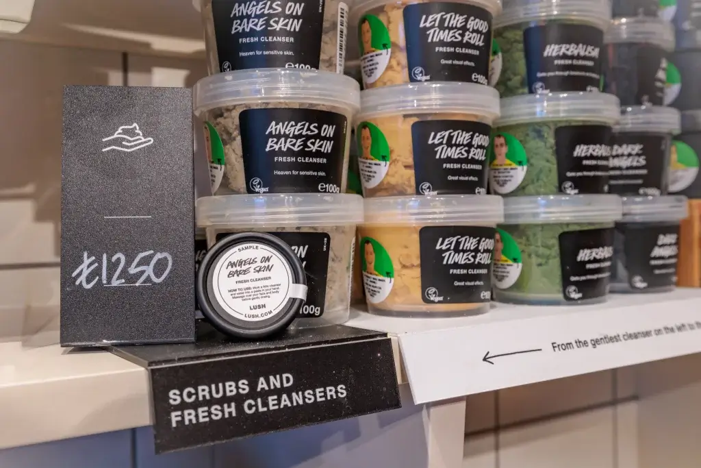 Stacked tubs of Lush scrubs and fresh cleansers, including Angels on Bare Skin and Let the Good Times Roll, priced £12.50