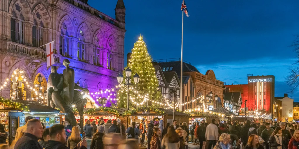 Christmas markets in chester with christmas tree and wooden huts
