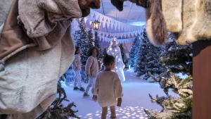 Children exploring Santas Enchanted Grotto with a snow queen