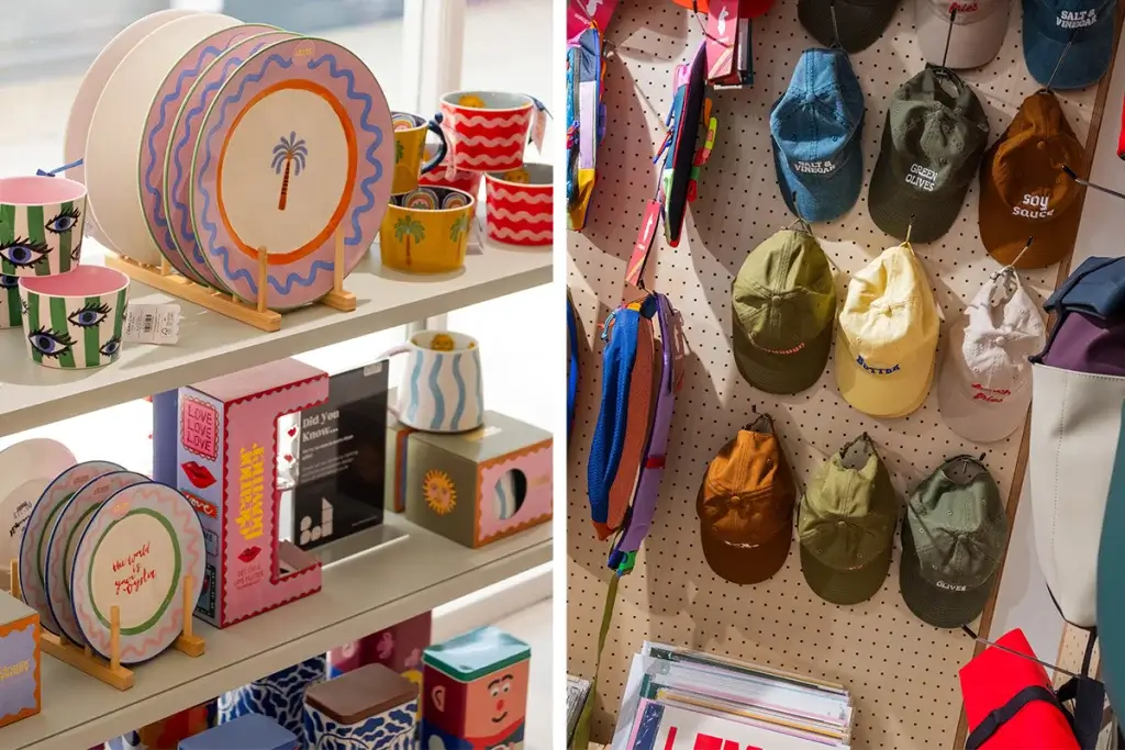 A display of colorful, patterned ceramics on the left, and a collection of caps in various colors on a wall pegboard on the right.