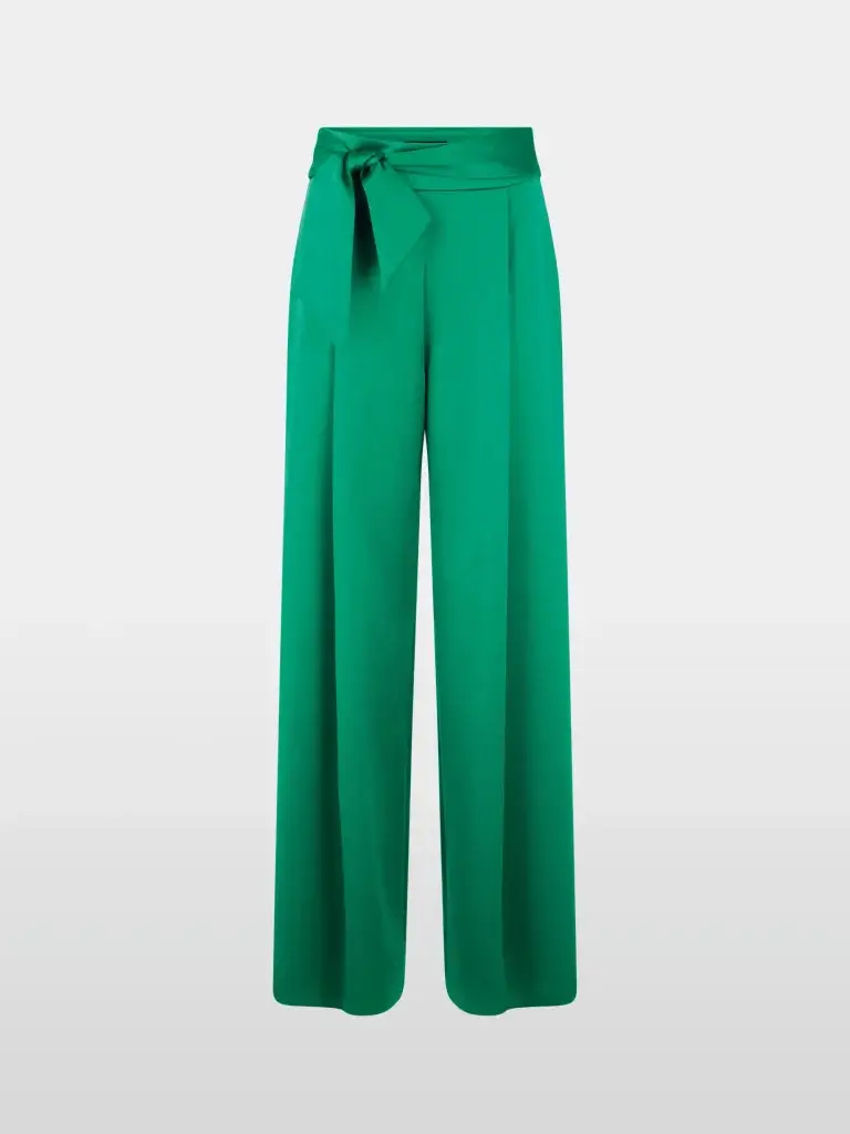 High-waisted wide-leg emerald green trousers with a tied sash belt and front pleats against a plain background