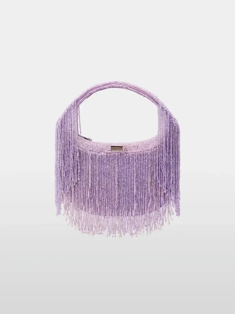 Lilac beaded shoulder bag with cascading fringe and a short rounded handle, front metal logo plate visible